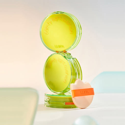 LUNA Comfy Light Cushion in lime green packaging with applicator, enhancing comfort and style in modern design.