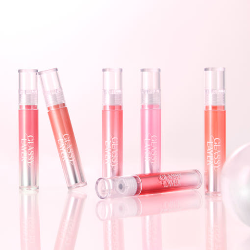 Assorted shades of LUNA Glassy Layer Tint displayed on a reflective surface.