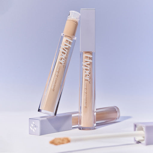 LUNA Hyper Cover Tip Concealer tubes showcased on a flat surface with blurred concealer applicator.