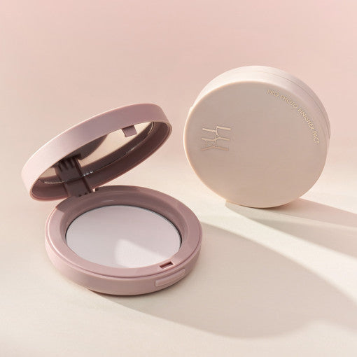 LUNA Pro Photo Finisher Powder Pact in sleek packaging, open compact with mirror and powder.