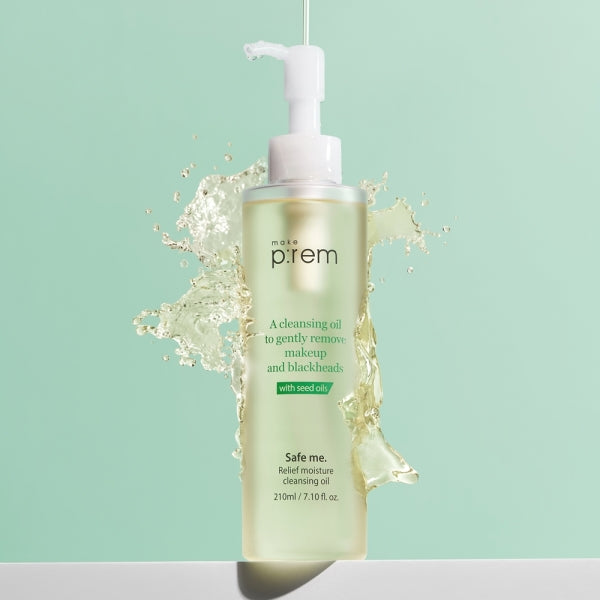MAKE P:REM Safe Me Relief Moisture Cleansing Oil 210ml bottle with oil splash on mint green background.