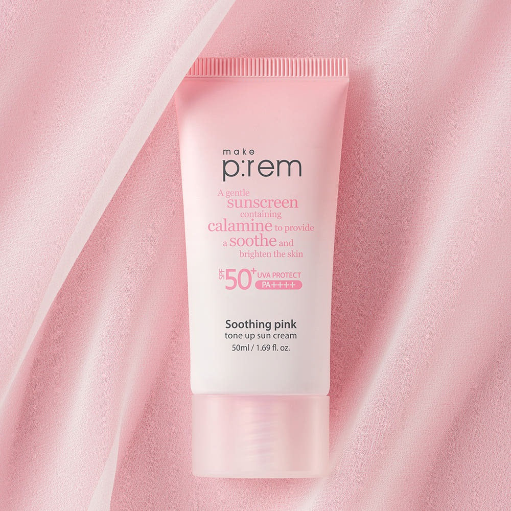 MAKE P:REM Soothing Pink Tone-Up Sunscreen SPF 50+ PA++++ 50ml pink tube on fabric background