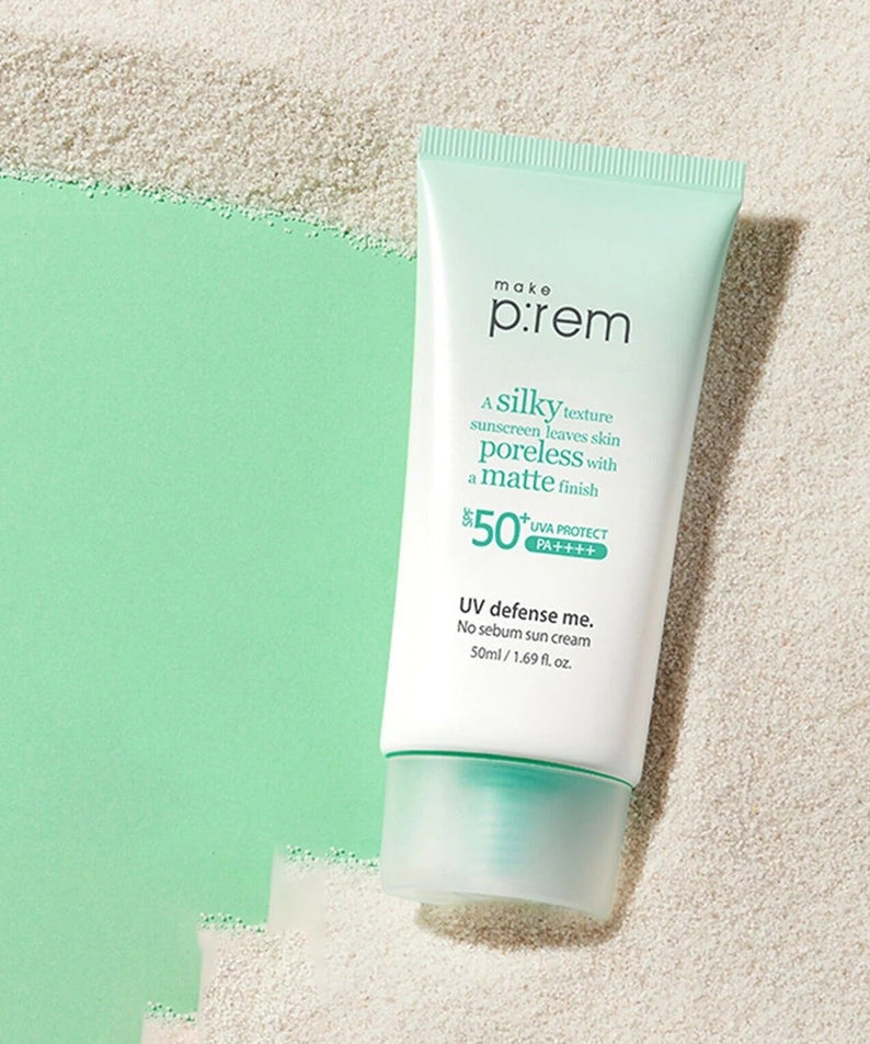 MAKE P:REM UV Defense Me No-Sebum Sunscreen 50ml tube on sand background