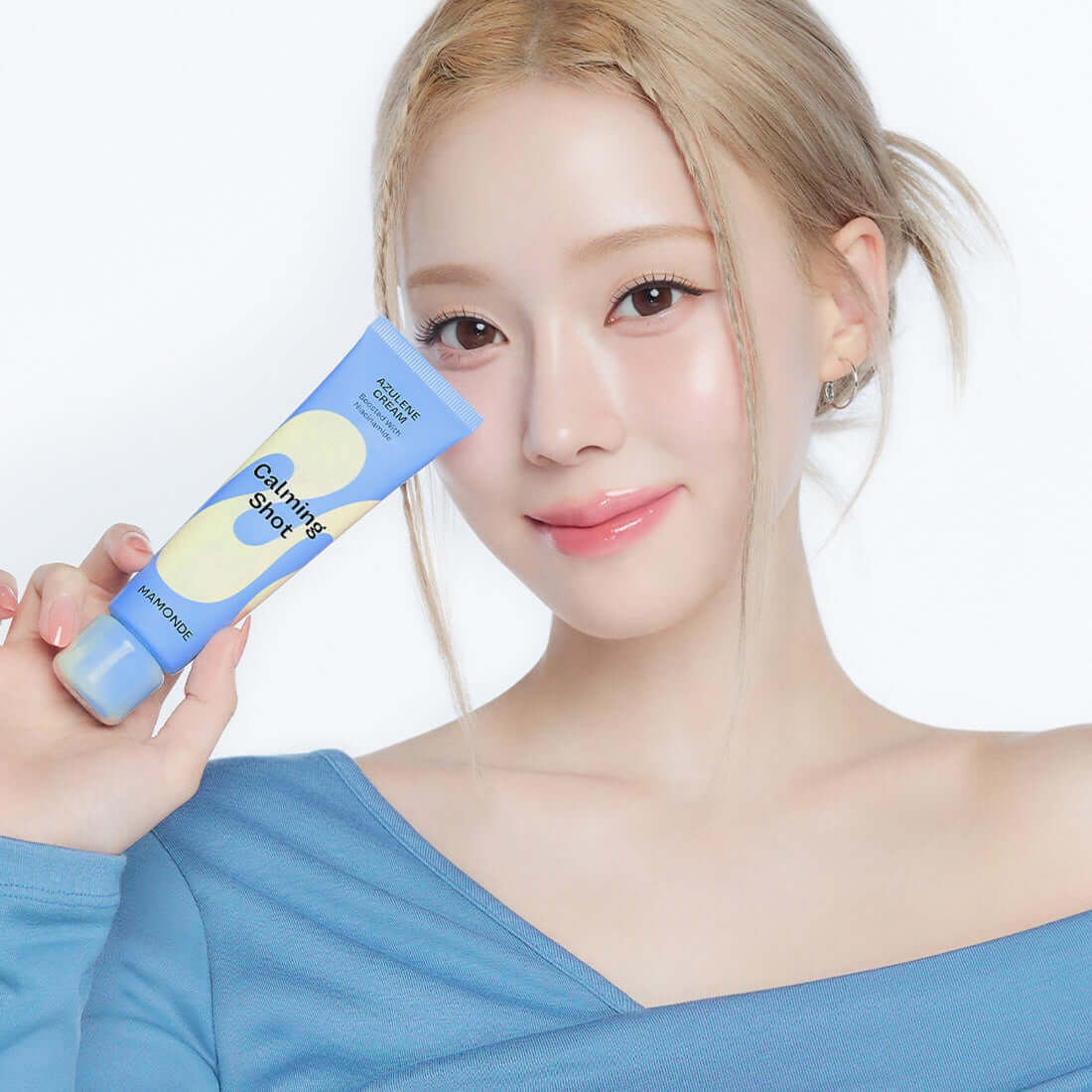 Woman holding MAMONDE Calming Shot Azulene Cream 60ml tube