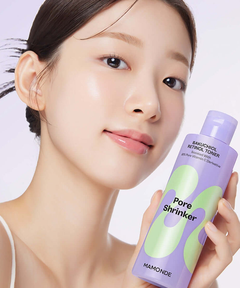 Woman holding MAMONDE Pore Shrinker Bakuchiol Retinol Toner 200ml bottle with radiant skin