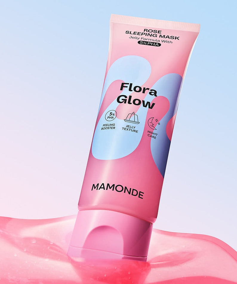 MAMONDE Flora Glow Rose Sleeping Mask 80ml product packaging with pink and blue design, displayed on a glossy surface.