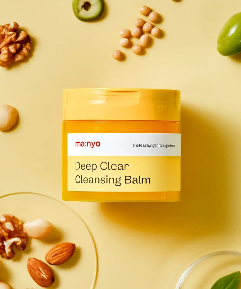 MANYO Deep Clear Cleansing Balm 132ml product image with natural ingredients on yellow background