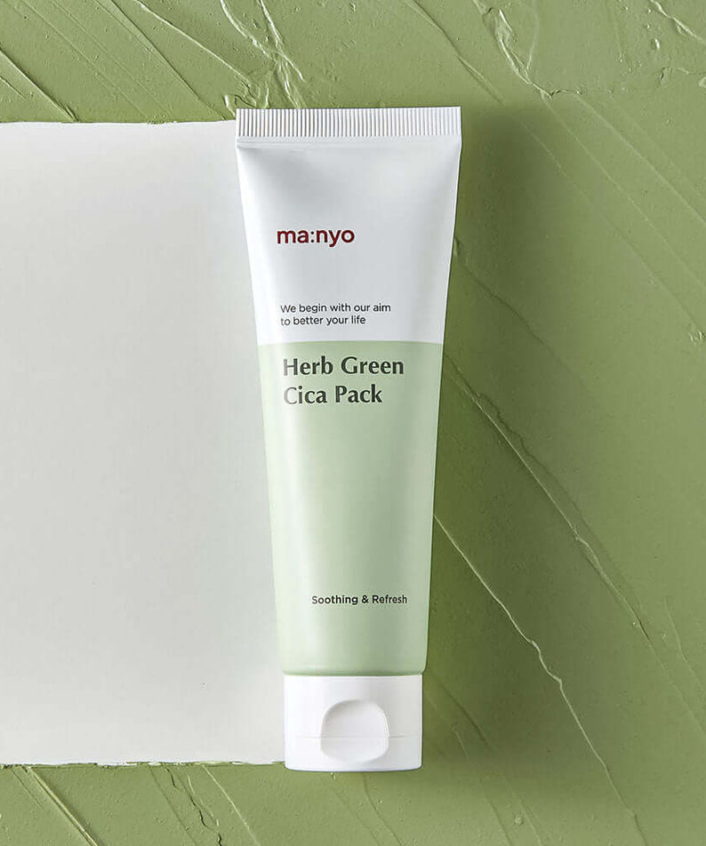 MANYO Herb Cica Pack 75ml product tube on green textured background.