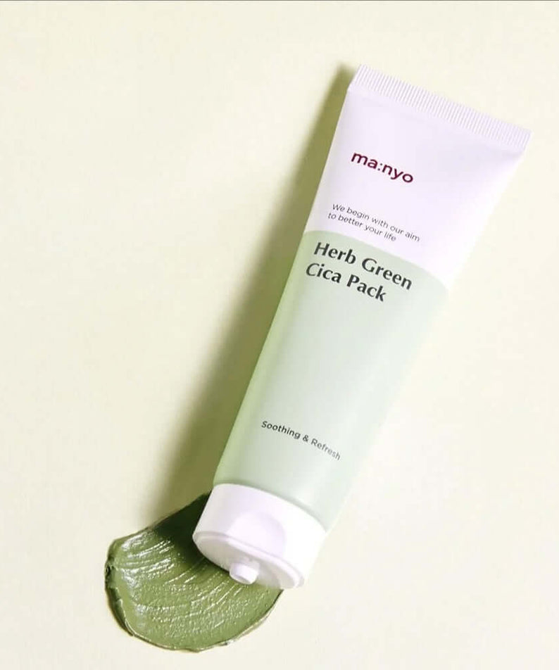 MANYO Herb Cica Pack 75ml tube on a soft green background, showcasing the product's soothing properties for skincare.