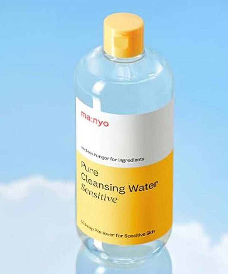 Bottle of MANYO Pore Cleansing Water Sensitive 500ml against a blue sky backdrop