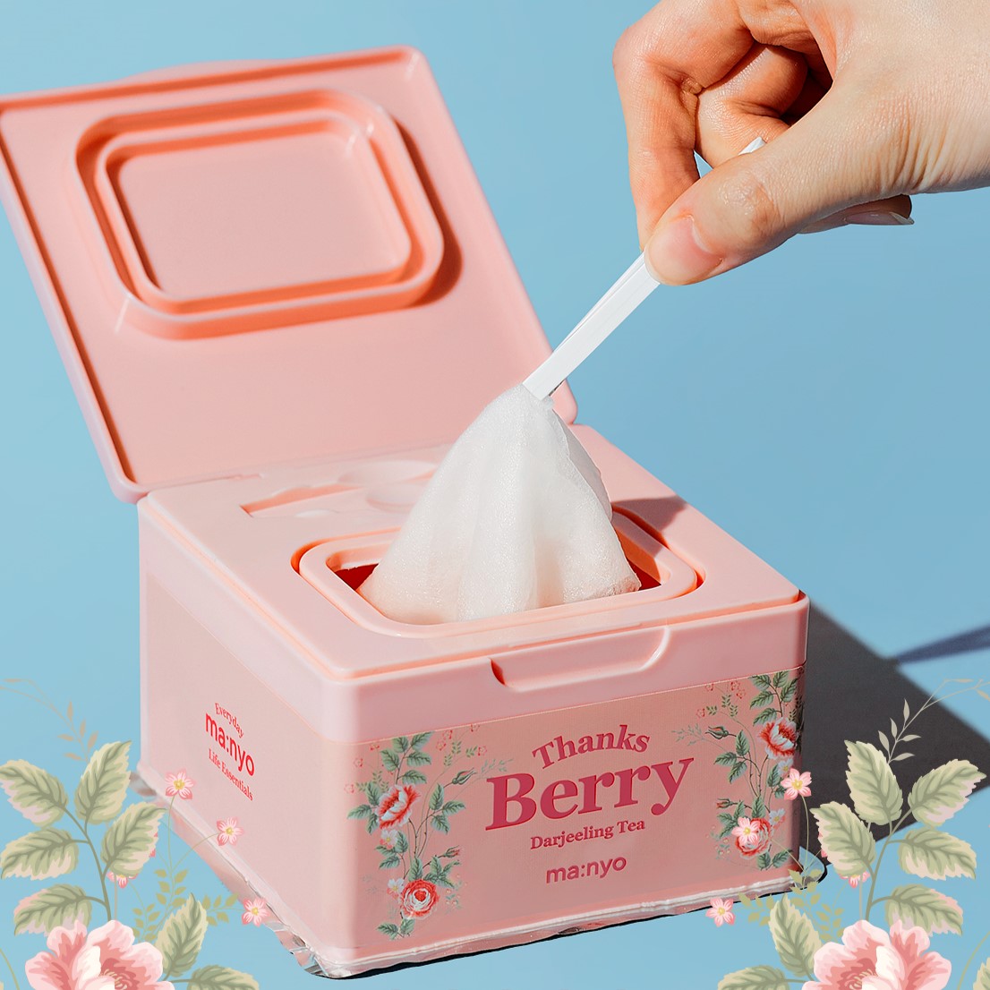 MA:NYO Thanks Berry Darjeeling Tea Facial Mask 310ml pack with floral design, showing hand using a facial mask wipe.