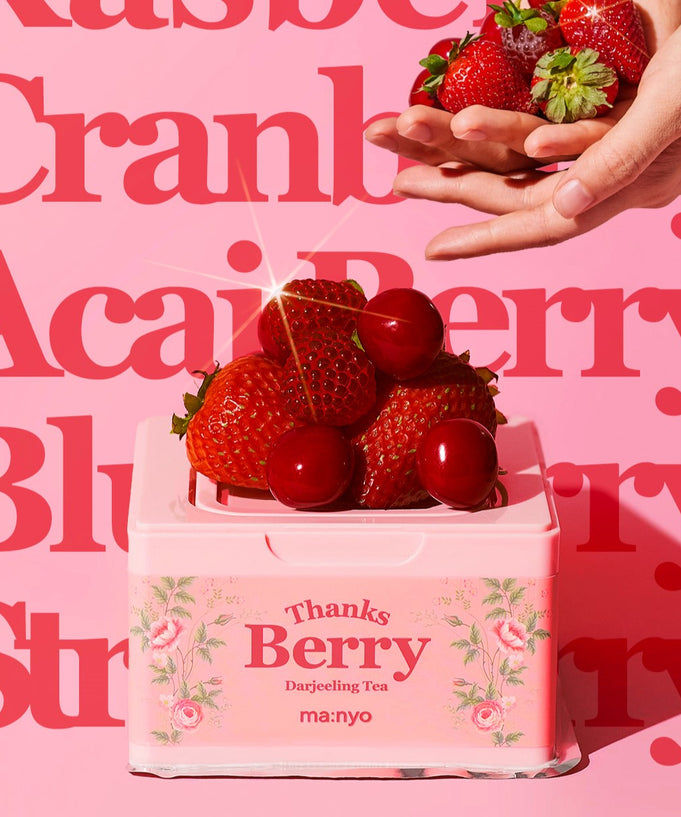 MA:NYO Thanks Berry Darjeeling Tea Facial Mask 310ml with fresh strawberries and cherries against a vibrant berry-themed background.