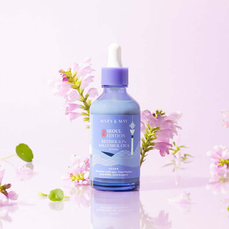 MARY & MAY Retinol 0.1% Bakuchiol Cica Serum 80ml with flower background
