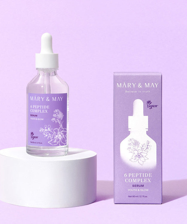 MARY&MAY 6 Peptide Complex Serum 80ml bottle and packaging on a pedestal against a purple background.