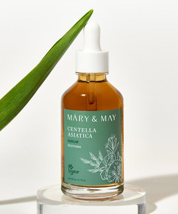 MARY&MAY Herbal Extract Serum 80ml bottle with a green label, surrounded by a leaf, highlighting the natural ingredients and vegan formula.