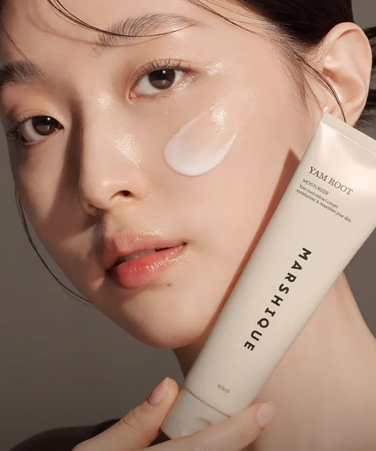 Model applying MARSHIQUE Yam Moisture Nourishing Cream 60ml on face for hydration
