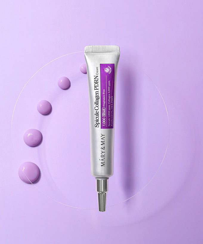 MARY&MAY Speckle Collagen PDRN Cream 15g tube on a purple background with cream droplets