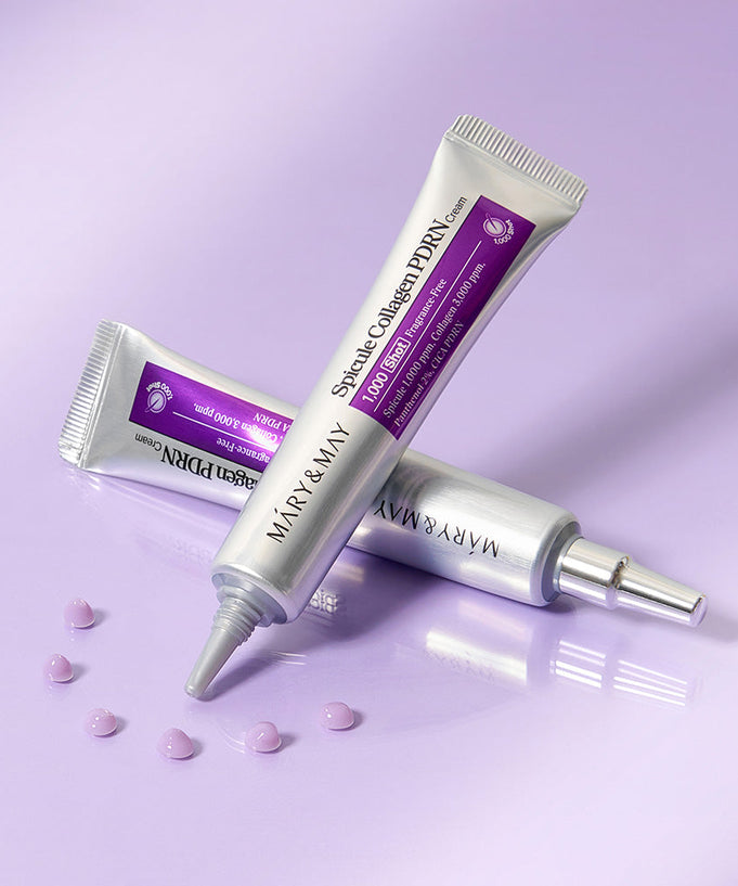 MARY&MAY Speckle Collagen PDRN Cream 15g tubes on a purple background with small cream dots
