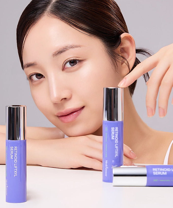 Woman posing with MEDIANSWER Retinoid Liftsil Serum 30ml, showcasing its sleek design and skincare benefits.