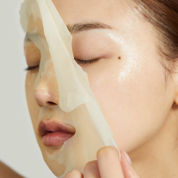 Person applying MEDICUBE Deep Vita C Daily Quick Mask 30 Sheets for skincare routine