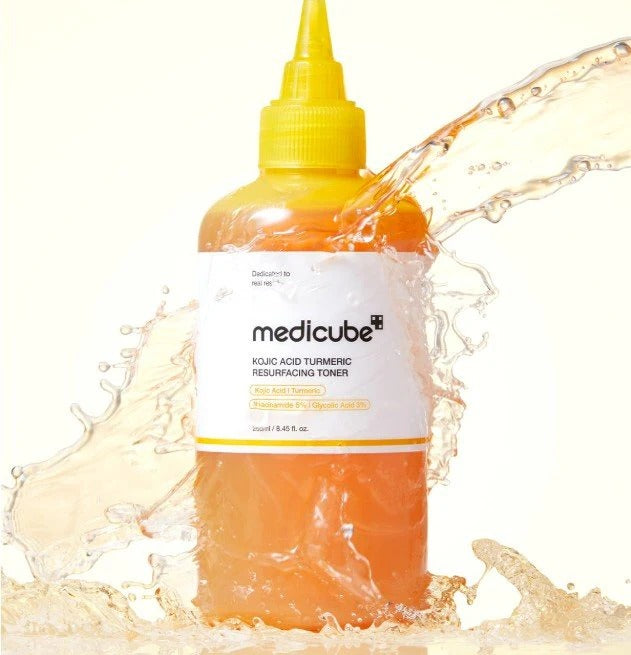 MEDICUBE Kiojic Acid Turmeric Resurfacing Toner 200ml bottle surrounded by splashing water