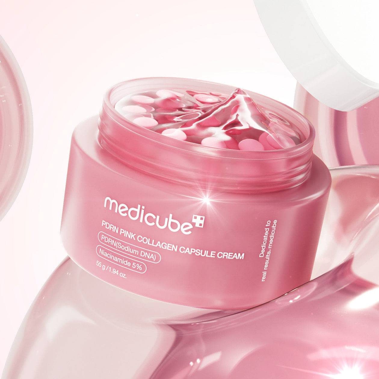 MEDICUBE PDRN Pink Collagen Capsule Cream 55g in open jar with pink capsules and cream, showcasing vibrant packaging.