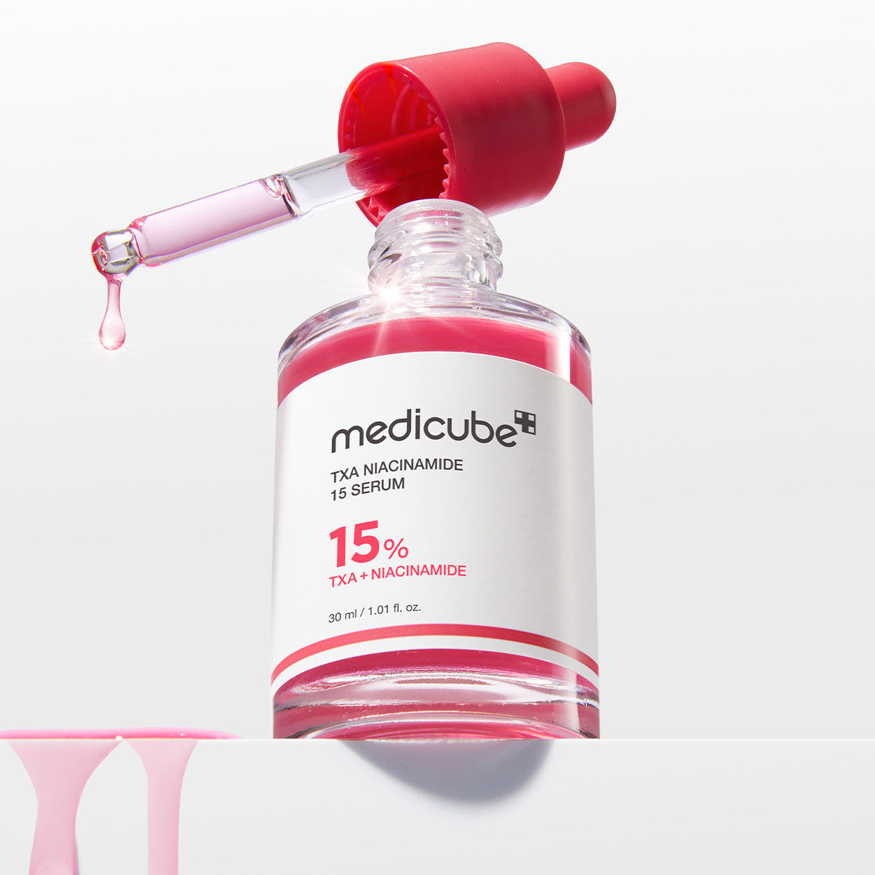 MEDICUBE TXA Trace Toning Serum 30ml with dropper, featuring niacinamide 15% for effective skin toning and brightening.