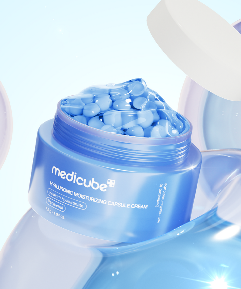 MEDICUBE Hyaluronic Moisturizing Capsule Cream 55g jar with blue capsules and lid, showcasing the product's design and hydrating formula.