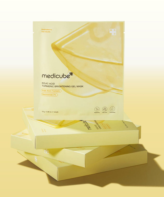 MEDICUBE Kojic Acid Turmeric Brightening Gel Mask packaging on display with golden boxes