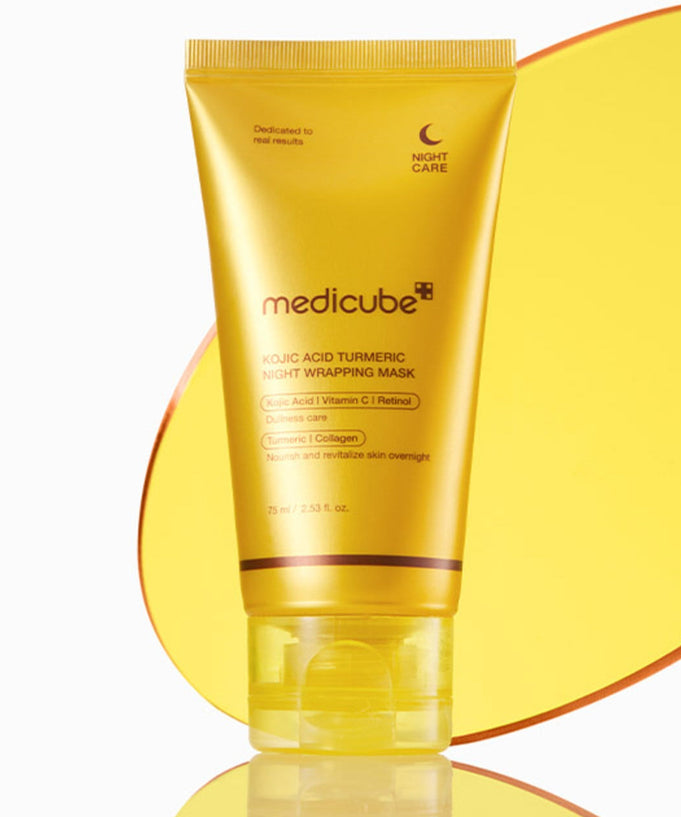 MEDICUBE Kojic Acid Turmeric Vita Wrapping Mask 75ml in yellow packaging on a reflective surface.