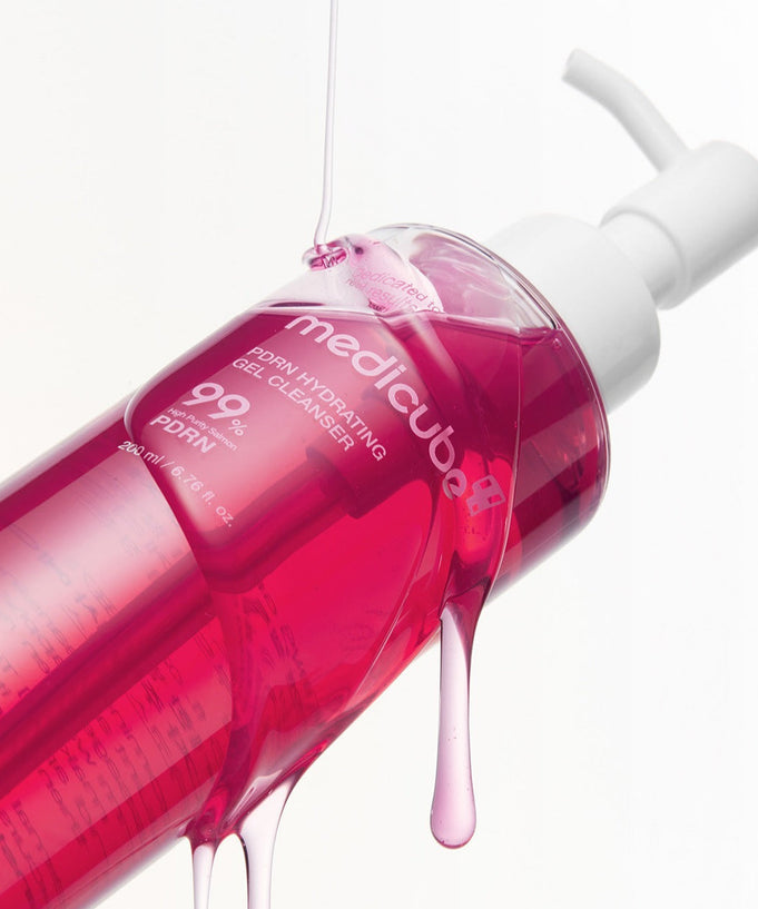 MEDICUBE PDRN Gel-To-Foam Cleanser 200ml bottle with pink liquid, angled view, emphasizing product design and bottle features.