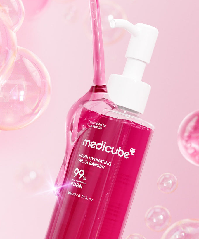 MEDICUBE PDRN Gel-To-Foam Cleanser 200ml bottle with bubbles and pink background.