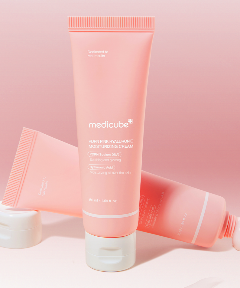MEDICUBE PDRN Pink Hyaluronic Moisturizing Cream 50ml in a pink tube with white cap displayed against a matching pink background.