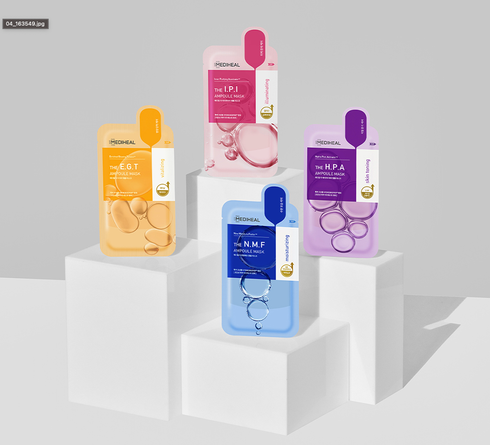 Display of four MEDIHEAL Ampoule Mask varieties on white podiums for skincare.
