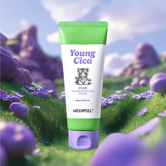 MEDIPEEL Young Cica PDRN Trouble Soothing Cream 80ml tube on grassy field background with purple flowers