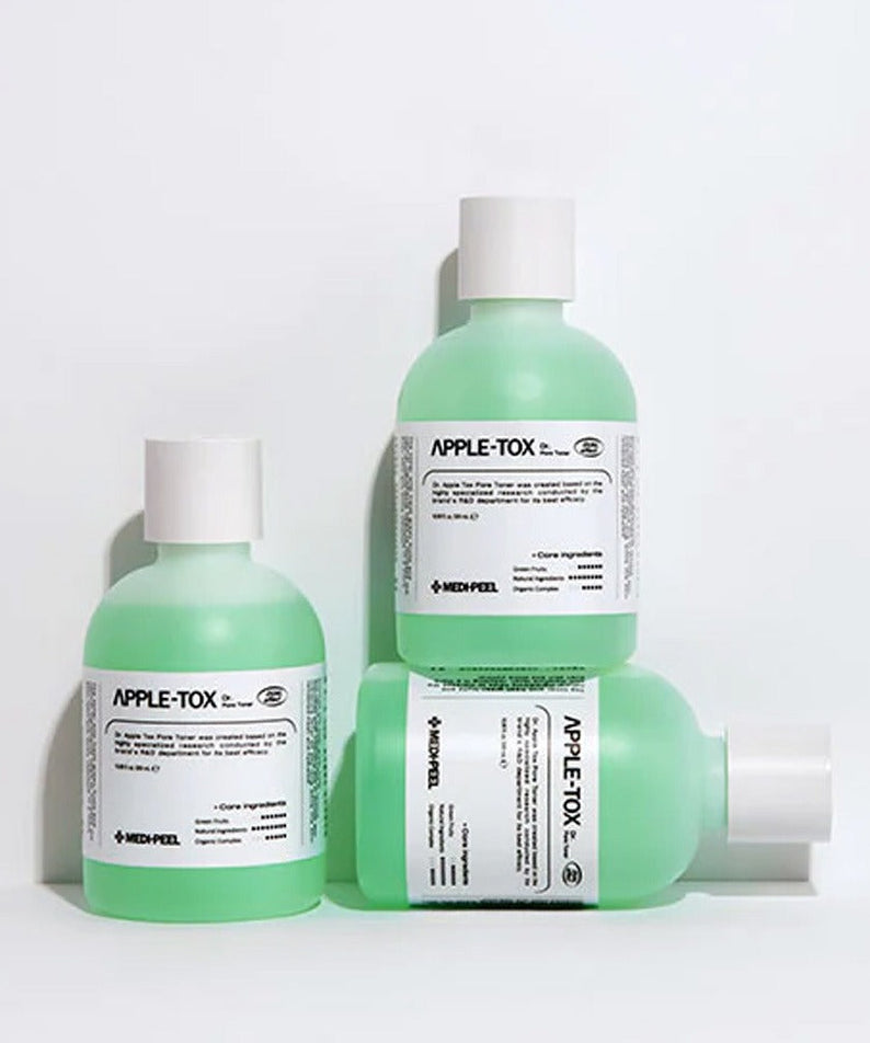 Three bottles of MEDIPEEL Dr.Apple Tox Pore Toner 500ml displayed on a white background