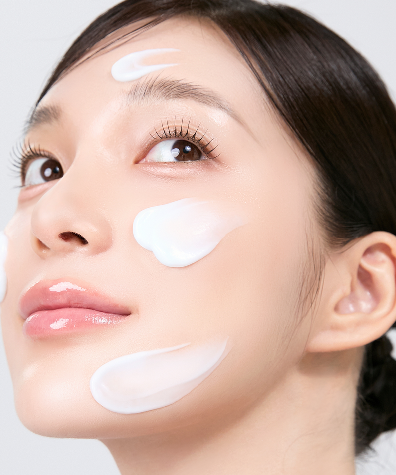 Woman applying MEDITHERAPY Squalane Skin Booster Moisturizer 150ml cream on face for healthy glow