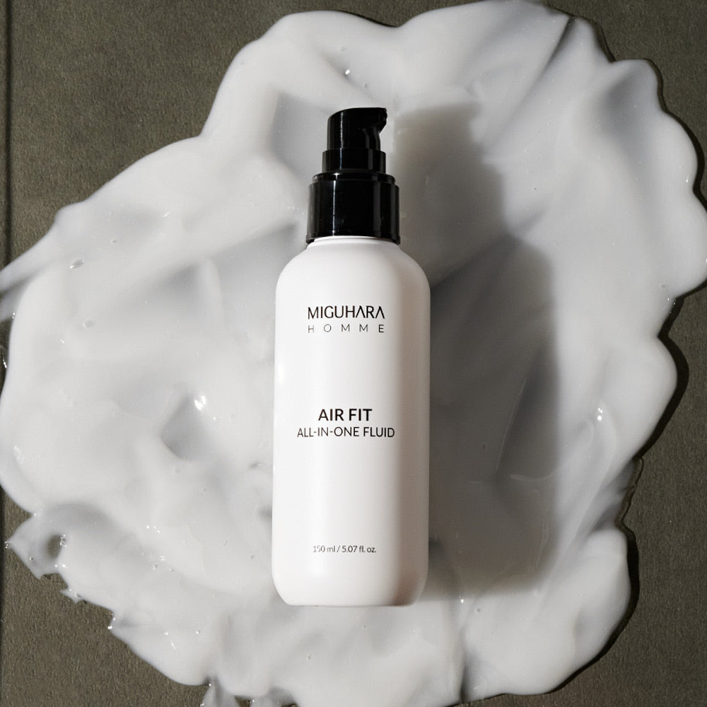 MIGUHARA Homme Air Fit All In One Fluid 150ml bottle on white foam background, Korean men's skincare by Gentleman Korea