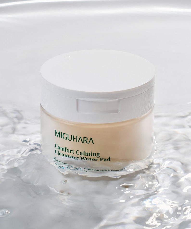 MIGUHARA Comfort Calming Cleansing Water Pads 70 Sheets in water, showcasing the soothing and cleansing properties of the product.