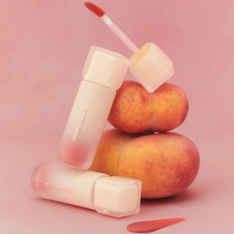 MILK TOUCH Spread Fit Blur Tint with peach backdrop and open applicator