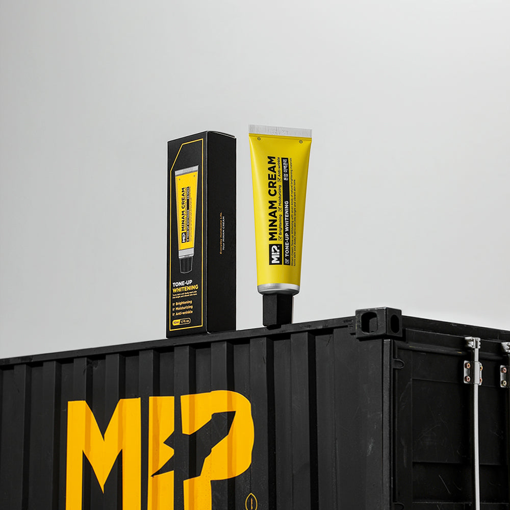 MIP Minam Cream Tone-Up Whitening Cream 50ml - Gentleman Korea product shot of yellow tube and box on black crate