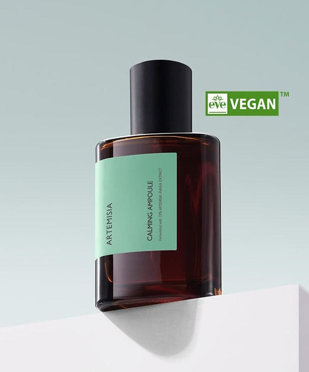 MISSHA Artemisia Calming Ampoule 75ml bottle on a white surface with vegan certification.