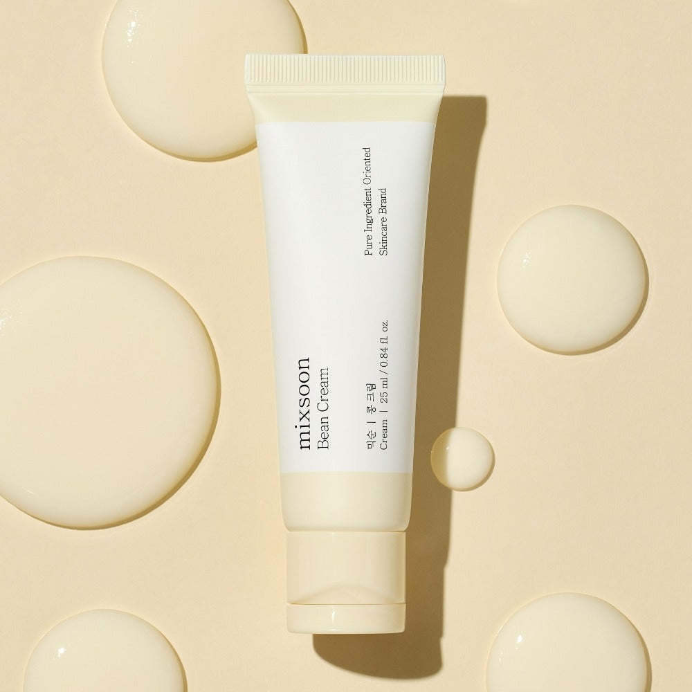 MIXSOON Bean Cream 25ml tube on beige background with cream droplets, skincare product packaging.