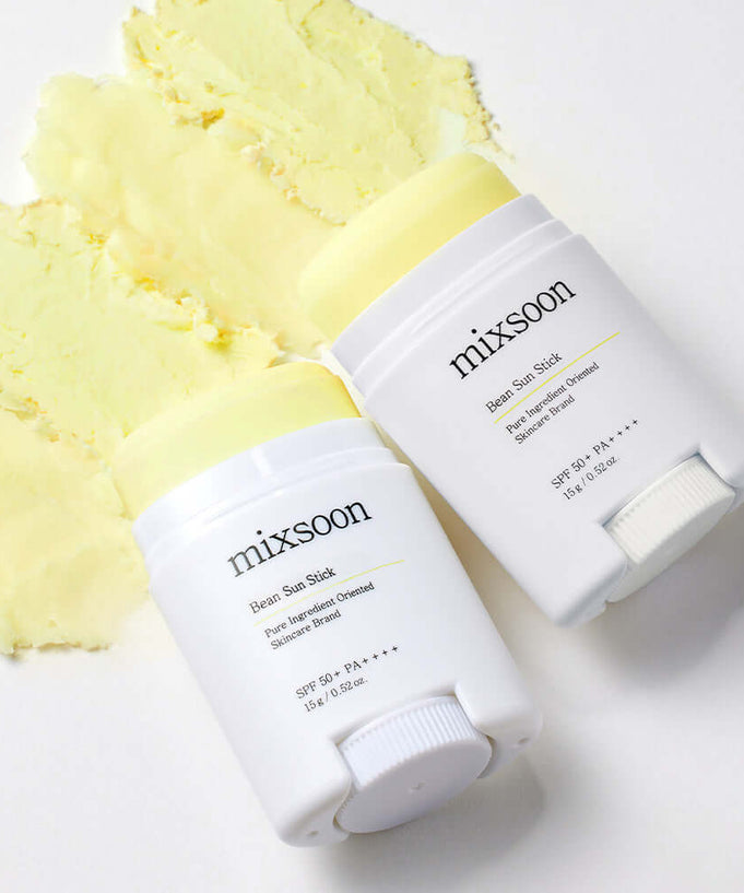 MIXSOON Bean Sun Stick SPF 50+ PA++++, yellow sun protection stick, skincare product displayed on white surface