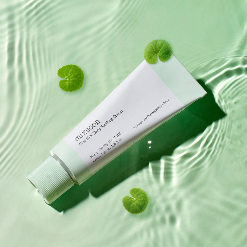 MIXSOON Cica Hyal Deep Soothing Cream 50ml tube on a reflective green background with leaves