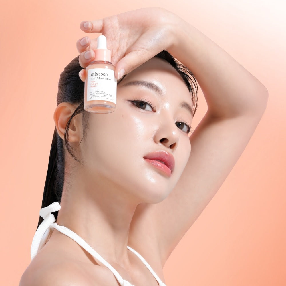 Woman holding bottle of MIXSOON PDRN Collagen Serum 30ml against an orange background