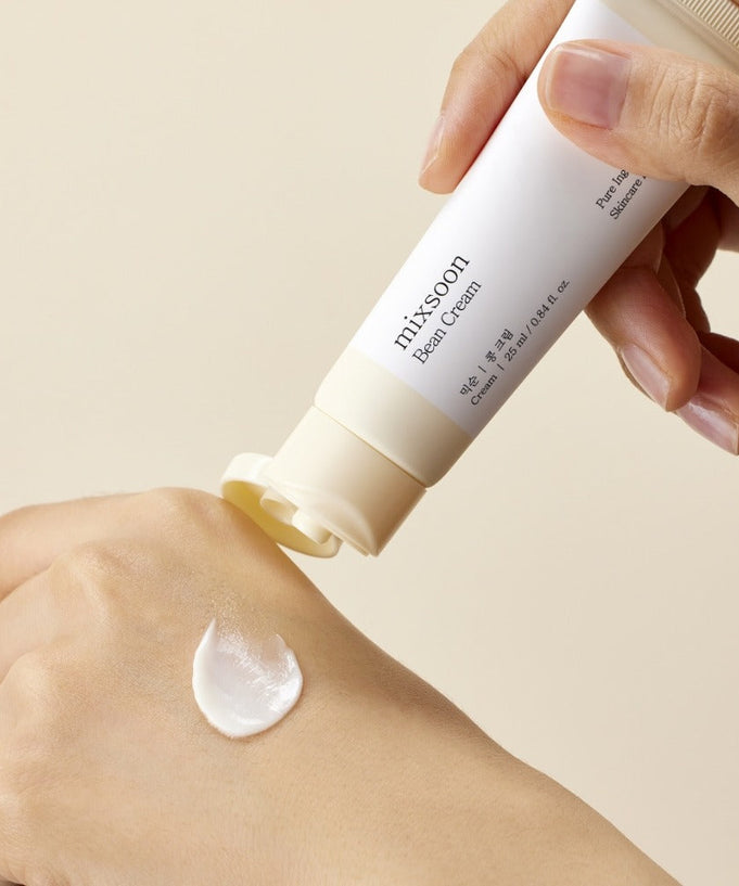 MIXSOON Bean Cream 25ml being applied to hand, showcasing texture and packaging.