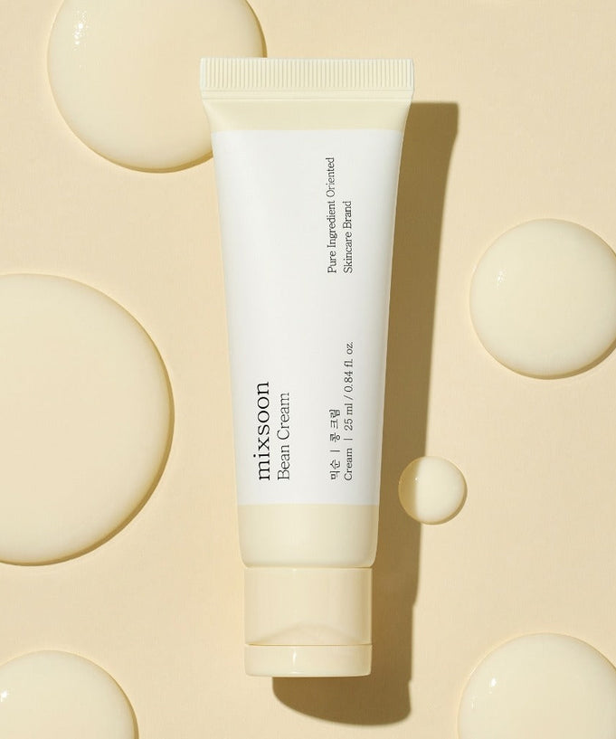 MIXSOON Bean Cream 25ml tube on beige background with cream droplets, skincare product packaging.