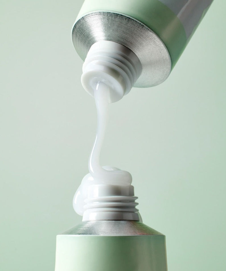 MIXSOON Cica Hyal Deep Soothing Cream 50ml being dispensed from tube in a close-up shot
