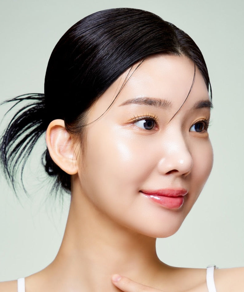 Woman with glowing skin possibly using MIXSOON Cica Hyal Deep Soothing Cream 50ml